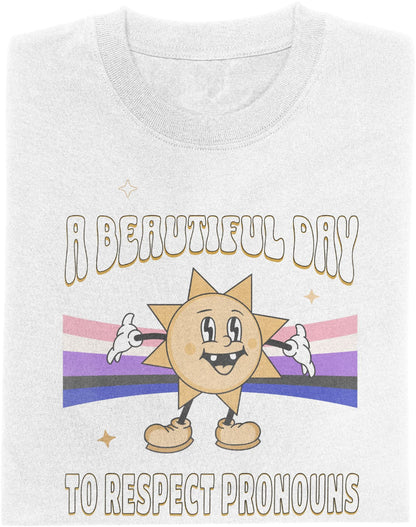 White T-shirt with cartoon sun character over genderfluid flag and text saying "A Beautiful Day to Respect Pronouns"